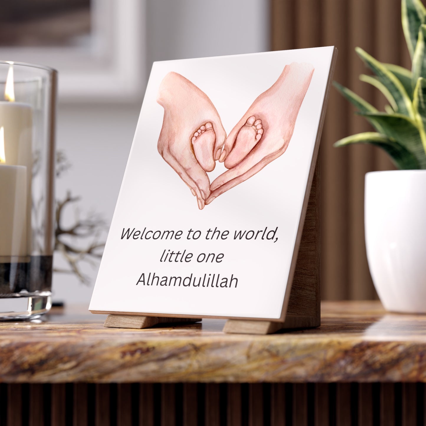 Islamic baby wall art with watercolor baby feet and hands in heart shape, with “Welcome to the world, little one – Alhamdulillah” text
