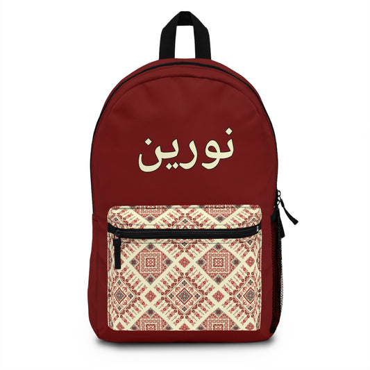 Red backpack with arabic name and front ethnic pocket – personalized for kids