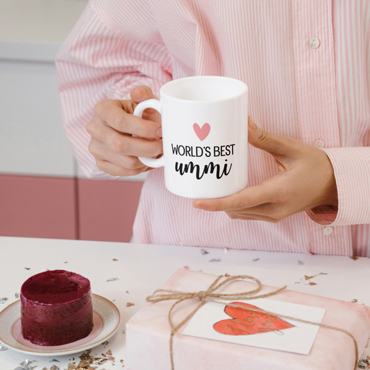 White mug with pink heart and black text “World’s Best Ummi” – Islamic gift for mothers.