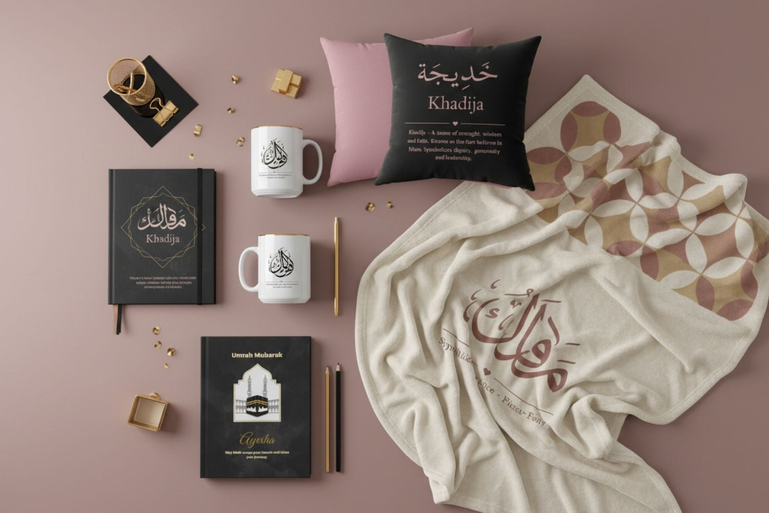 Luxury personalized gifts flatlay on rose taupe background - Arabic name mugs, journals, cushions and blankets with gold accents
