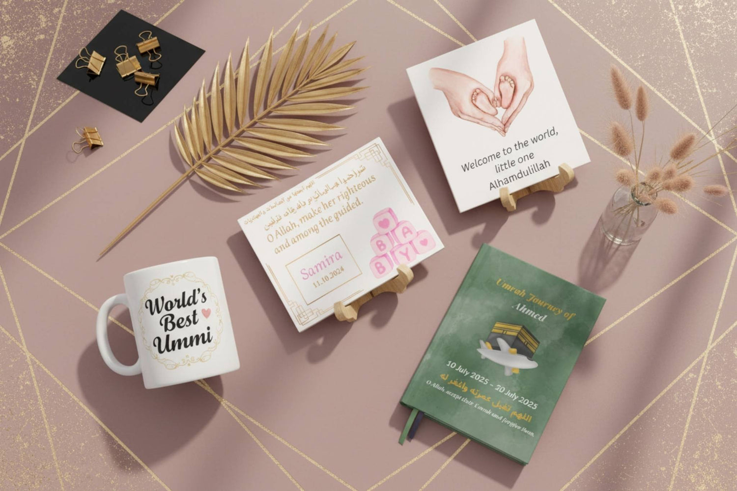 Luxury special moments flatlay on rose taupe background - World's Best Ummi mug, personalized baby tiles and Umrah journal with gold accents