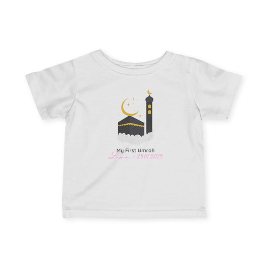 Personalized baby Umrah t-shirt with Kaaba and minaret design, featuring name and date