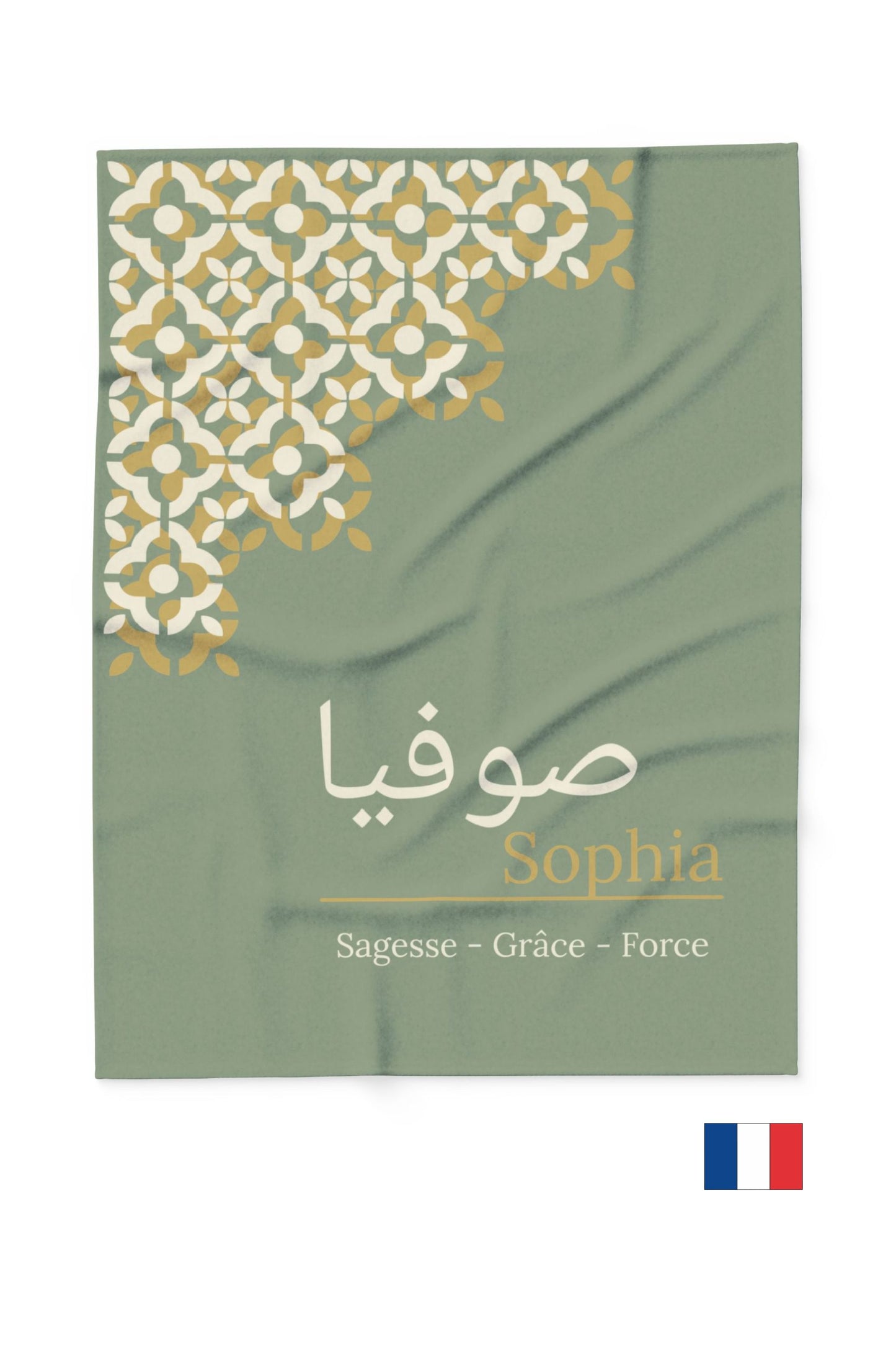 Personalized sage green fleece throw styled on cream sofa in minimalist Scandinavian living room