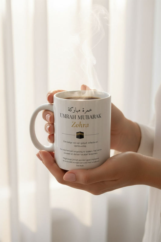 Personalized Umrah Mubarak mug with Arabic calligraphy held in hands with hot coffee and steam — custom umrah gift