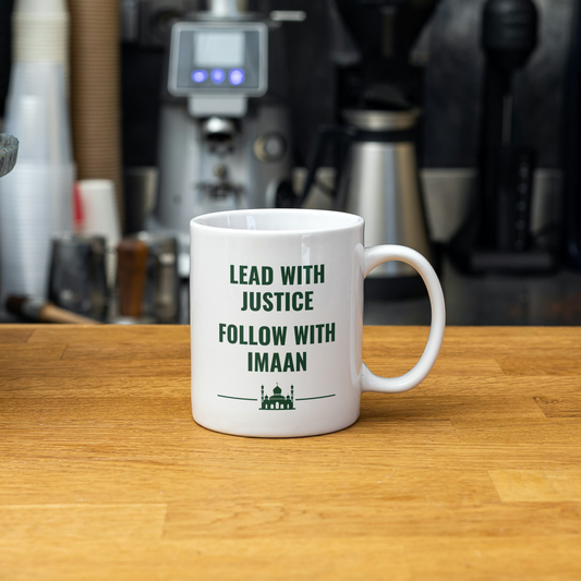 White mug with the quote “Lead with Justice, Follow with Imaan” and a mosque silhouette – perfect Islamic gift for a mindful Muslim man.