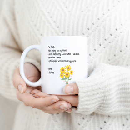 White mug with Islamic dua for mother, yellow flower bouquet, and personalized signature “Love, Custom Name”.